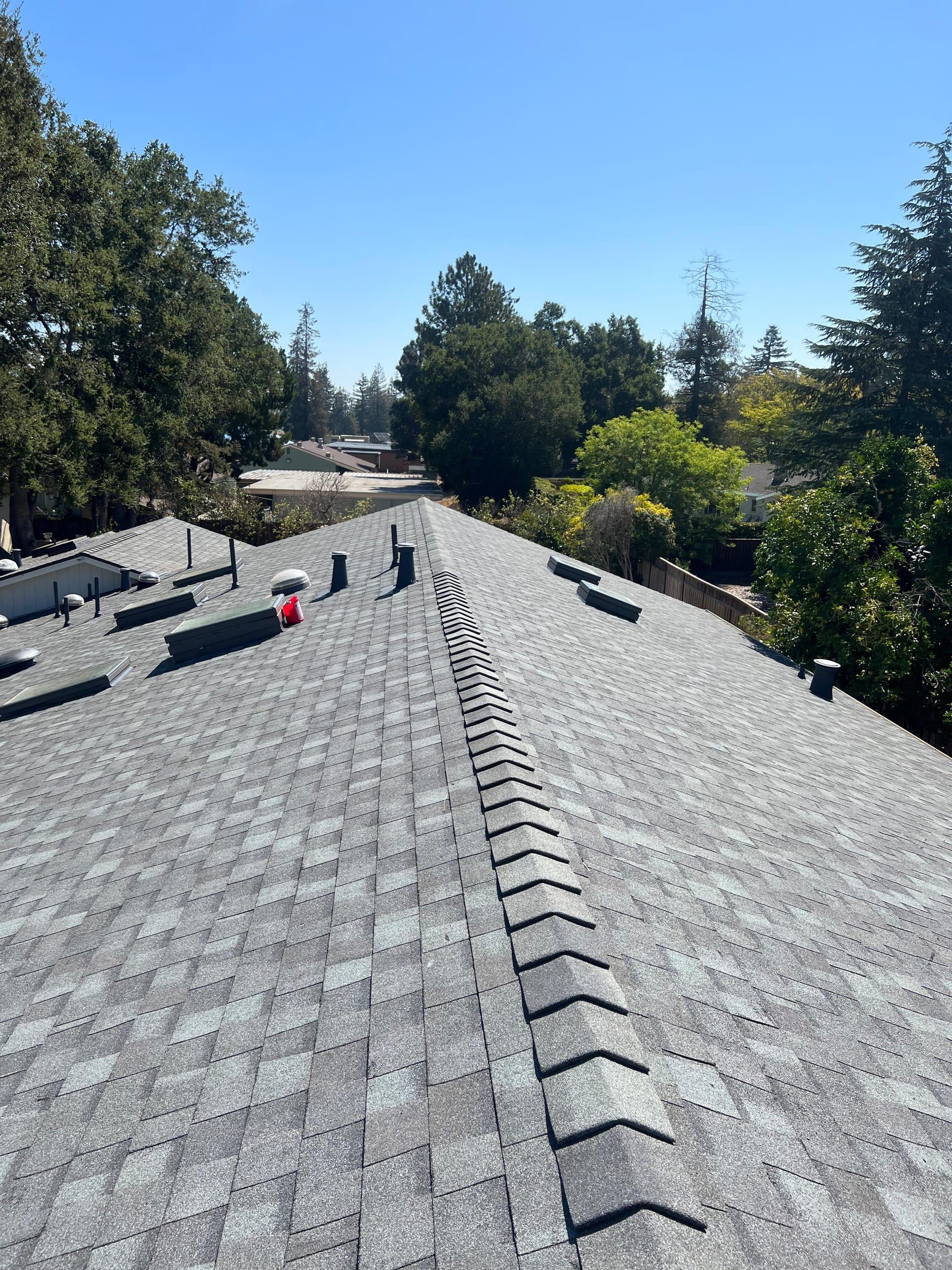 Newly installed architectural shingle roof with ridge vents on a Bay Area residential home by Gadget Construction